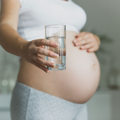 Pregnant Woman Holding Glass